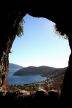 Kalymnos - looking across the bay from one of the caves in the cliff below the Kastri above Emborios in the evening light