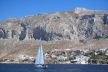 Kalymnos - looking from Telendos to Myrties on Kalymnos with the barren, craggy limestone ridge behind