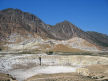 Nisyros - view of the crater from the west  and part of the edge of the caldera including the mountain of Diavatis