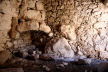 Nisyros - the uppermost part of the Siones complex is a single-room living space with original artifacts including the corner fireplace and pestles for grinding - here seen from the 'far end' of the room