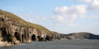 the cliffs and caves looking towards Southerndown: the tide comes to the base of the cliffs well before high tide